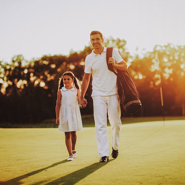 dad and daughter golfing