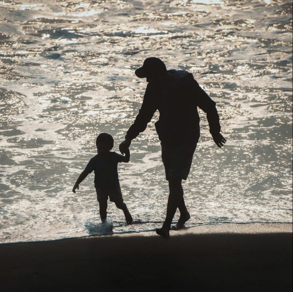 dad and child at beach